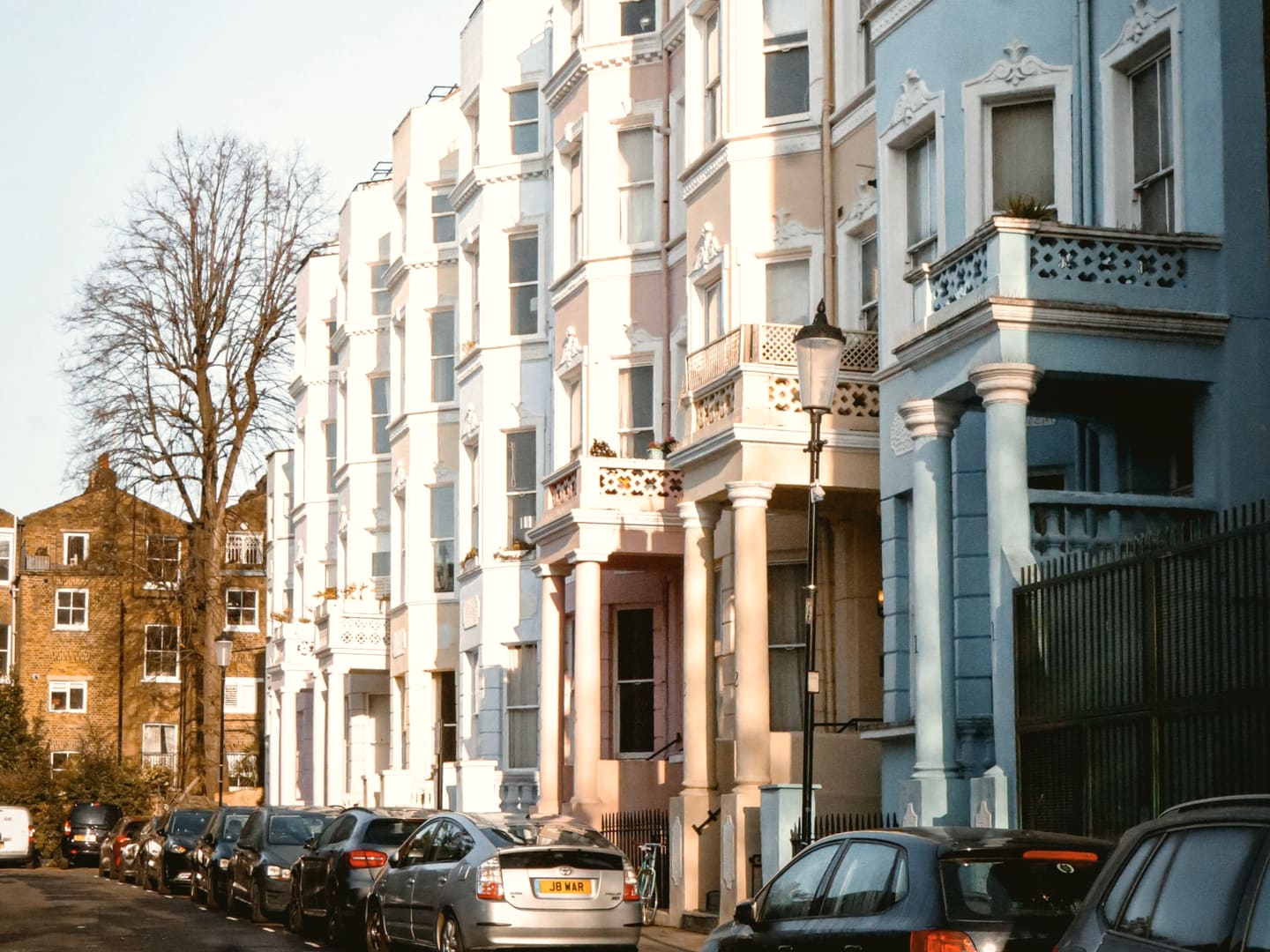 Pastel-coloured houses in Notting Hill near Ladbroke Grove