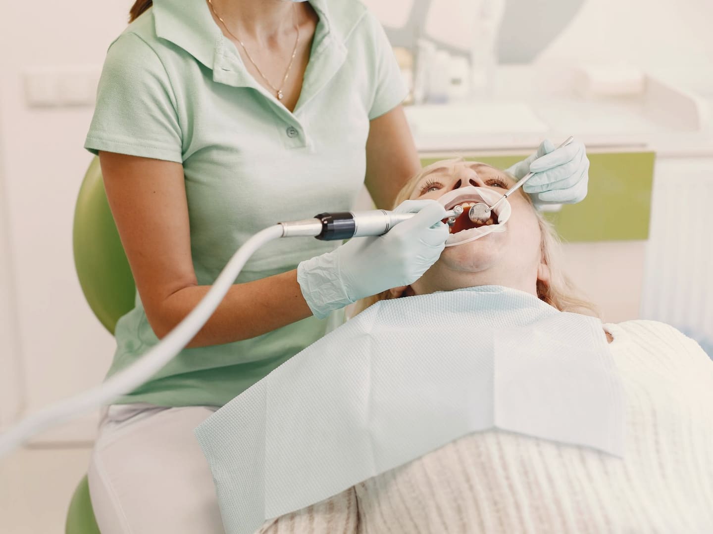 Dentist examining a patient’s gums