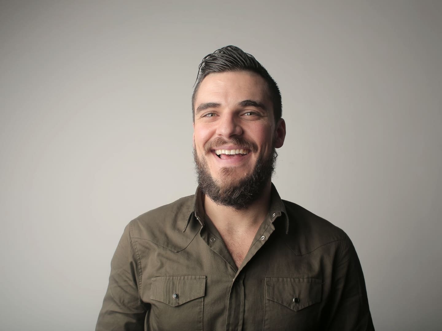Man laughing, relaxed after a weekend dental appointment
